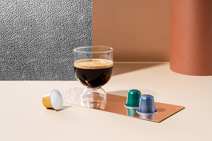 Belmio capsules and a fresh cup of coffee